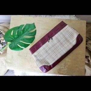 Tan and burgundy woven and leather clutch